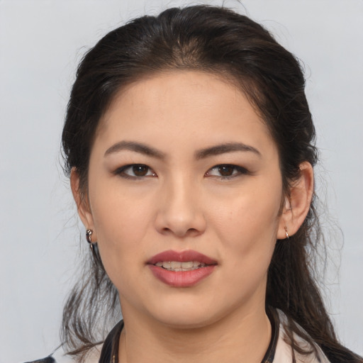 Joyful white young-adult female with medium  brown hair and brown eyes