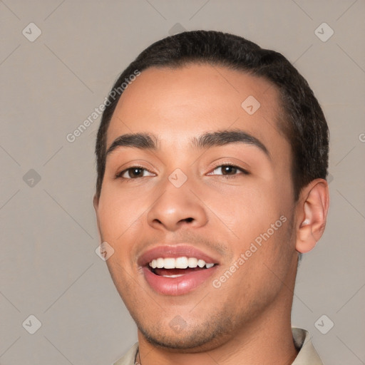 Joyful white young-adult male with short  black hair and brown eyes