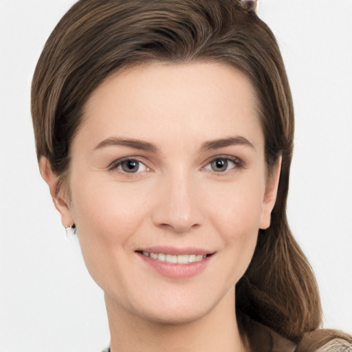 Joyful white young-adult female with long  brown hair and grey eyes