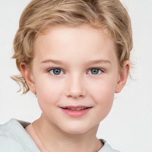 Joyful white child female with short  brown hair and blue eyes