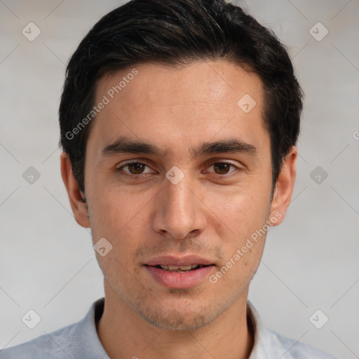 Joyful white young-adult male with short  black hair and brown eyes