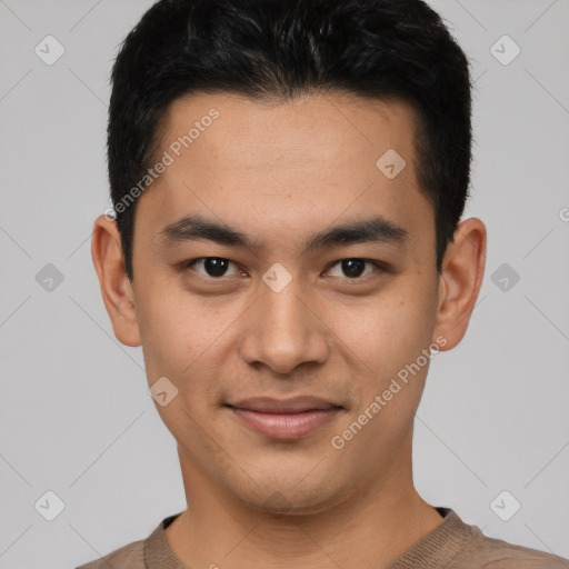 Joyful asian young-adult male with short  black hair and brown eyes