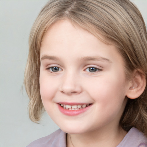 Joyful white child female with medium  brown hair and grey eyes