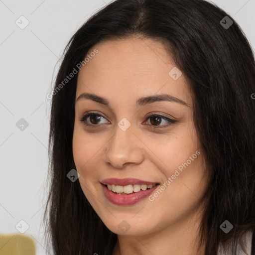 Joyful asian young-adult female with long  brown hair and brown eyes