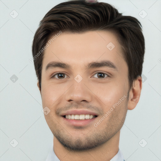 Joyful white young-adult male with short  brown hair and brown eyes