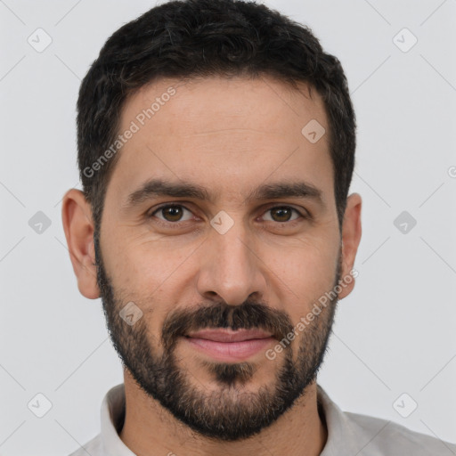 Joyful white young-adult male with short  black hair and brown eyes