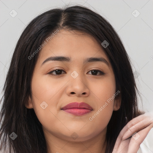 Joyful asian young-adult female with long  brown hair and brown eyes