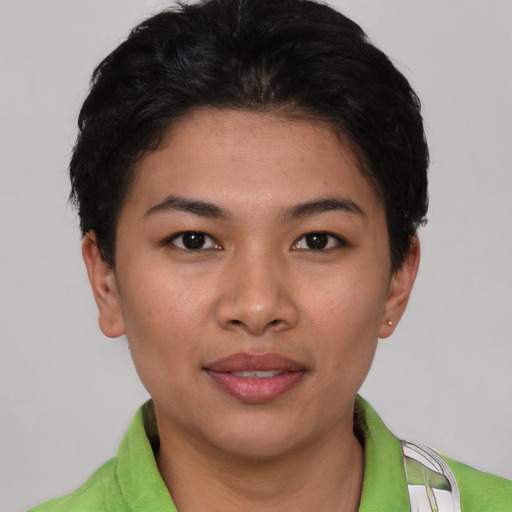 Joyful asian young-adult female with short  brown hair and brown eyes