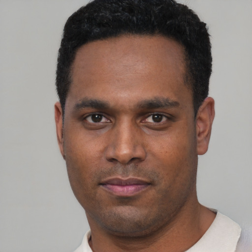 Neutral black young-adult male with short  black hair and brown eyes