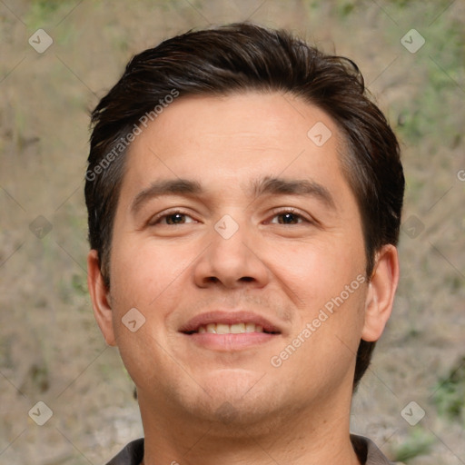 Joyful white adult male with short  brown hair and brown eyes