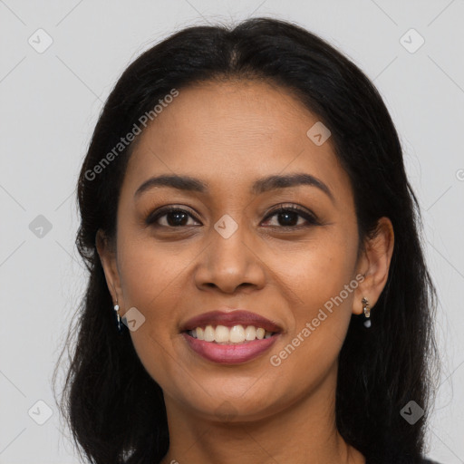 Joyful latino young-adult female with long  brown hair and brown eyes