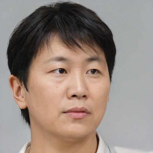 Neutral asian young-adult male with short  brown hair and brown eyes