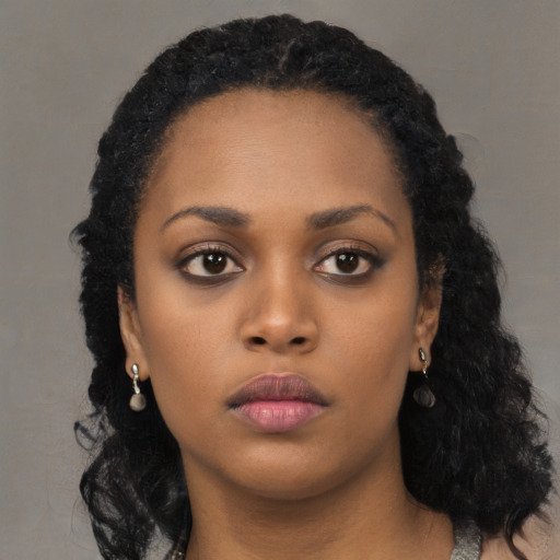 Neutral black young-adult female with long  black hair and brown eyes