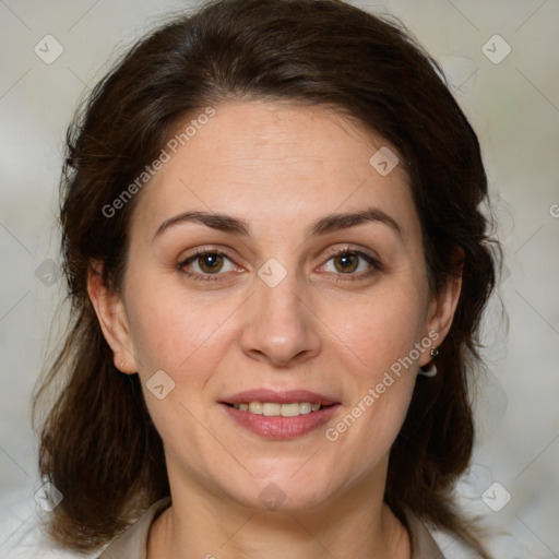 Joyful white adult female with medium  brown hair and green eyes