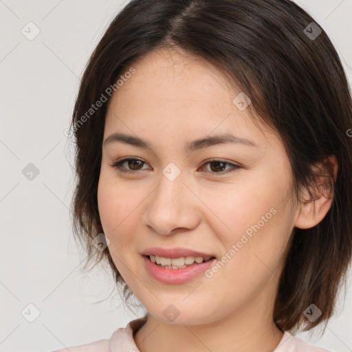 Joyful white young-adult female with medium  brown hair and brown eyes