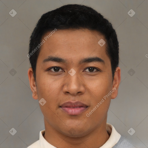 Joyful latino young-adult male with short  black hair and brown eyes