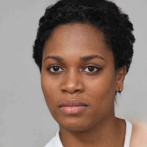 Neutral black young-adult female with short  black hair and brown eyes