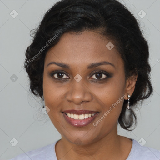 Joyful black young-adult female with long  brown hair and brown eyes