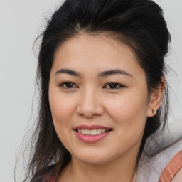 Joyful asian young-adult female with medium  brown hair and brown eyes