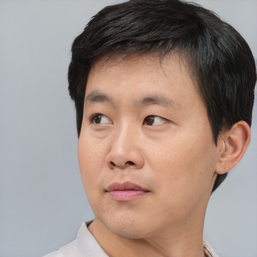 Neutral asian young-adult male with short  black hair and brown eyes