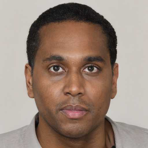 Neutral black young-adult male with short  black hair and brown eyes