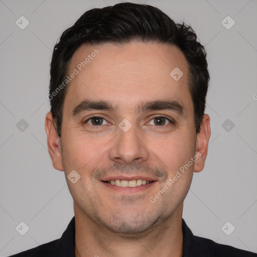 Joyful white young-adult male with short  black hair and brown eyes