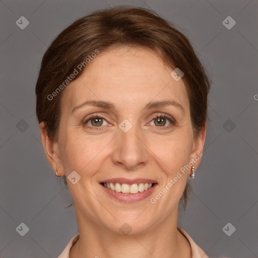 Joyful white adult female with short  brown hair and grey eyes