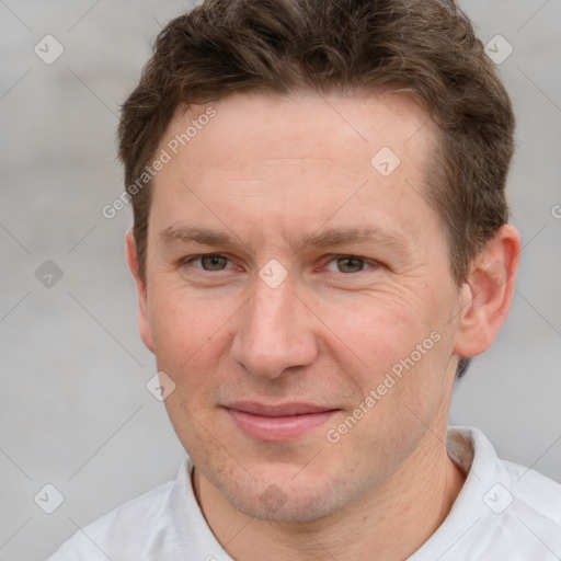 Joyful white adult male with short  brown hair and grey eyes