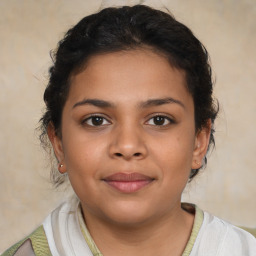 Joyful latino young-adult female with short  brown hair and brown eyes