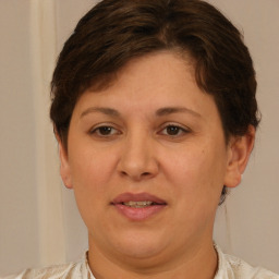 Joyful white adult female with short  brown hair and brown eyes