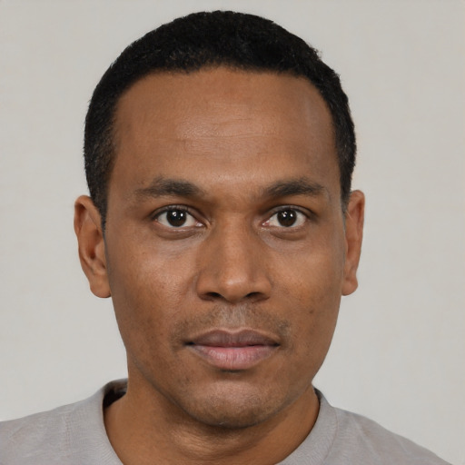 Neutral black young-adult male with short  black hair and brown eyes
