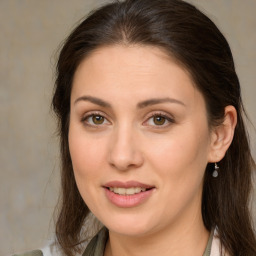 Joyful white young-adult female with medium  brown hair and brown eyes