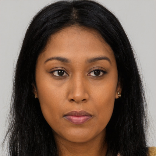 Joyful asian young-adult female with long  brown hair and brown eyes