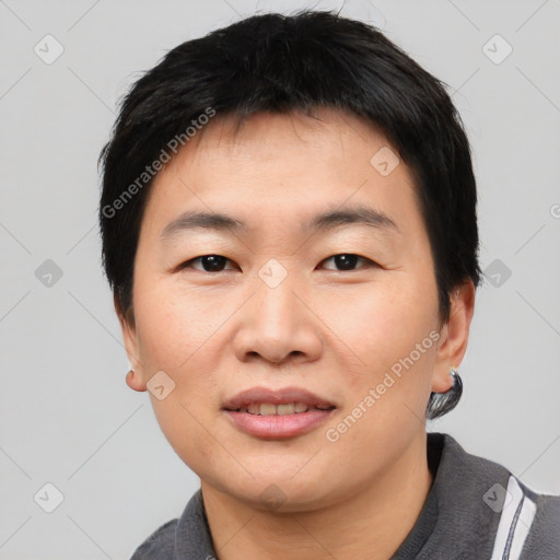 Joyful asian young-adult male with short  black hair and brown eyes