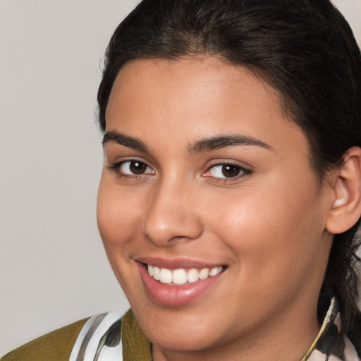 Joyful white young-adult female with medium  brown hair and brown eyes