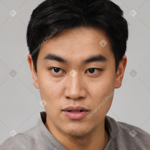 Neutral asian young-adult male with short  black hair and brown eyes