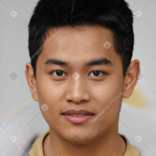 Joyful asian young-adult male with short  black hair and brown eyes