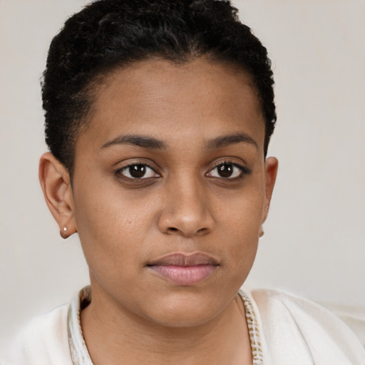 Joyful latino young-adult female with short  brown hair and brown eyes