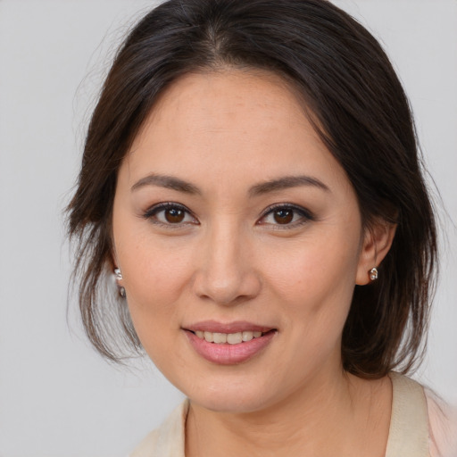 Joyful white young-adult female with medium  brown hair and brown eyes