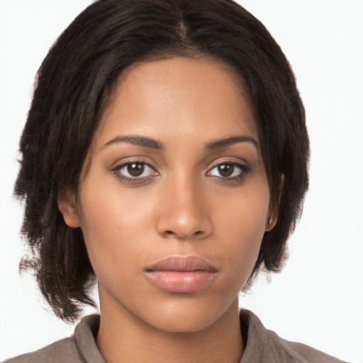 Neutral latino young-adult female with medium  brown hair and brown eyes