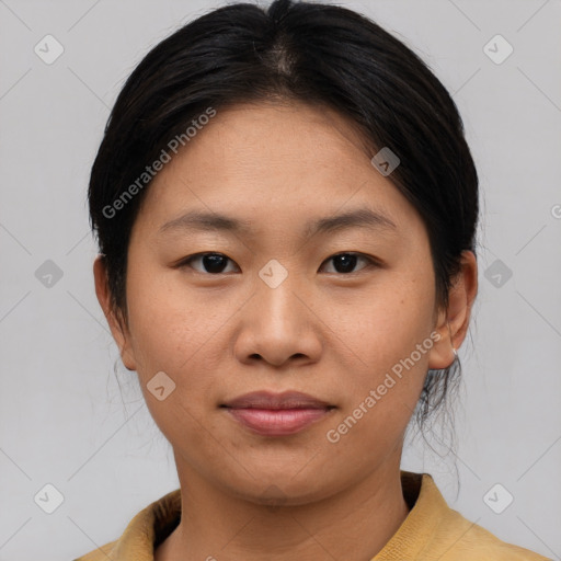 Joyful asian young-adult female with medium  brown hair and brown eyes