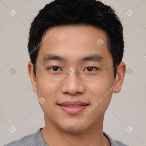 Joyful asian young-adult male with short  black hair and brown eyes