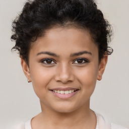 Joyful white child female with short  brown hair and brown eyes