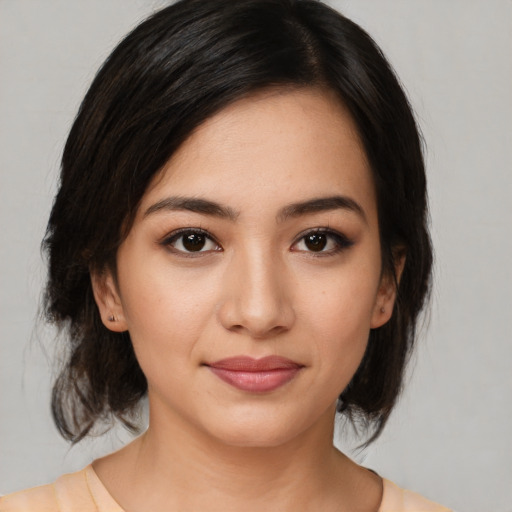 Joyful white young-adult female with medium  black hair and brown eyes