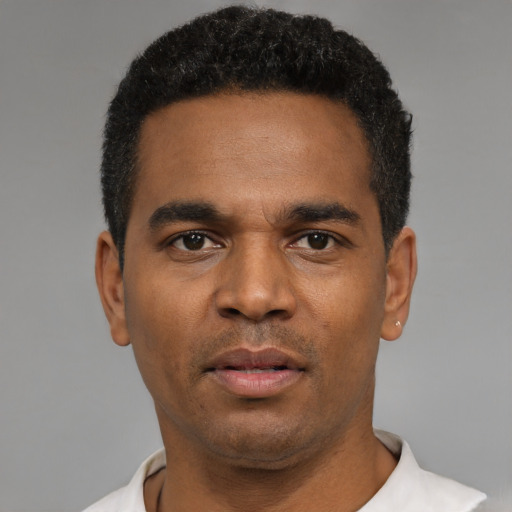 Neutral black young-adult male with short  black hair and brown eyes