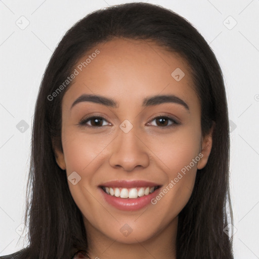 Joyful latino young-adult female with long  brown hair and brown eyes