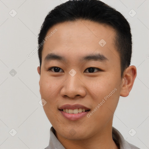 Joyful asian young-adult male with short  brown hair and brown eyes