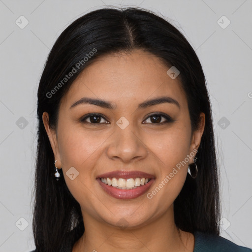 Joyful latino young-adult female with long  brown hair and brown eyes