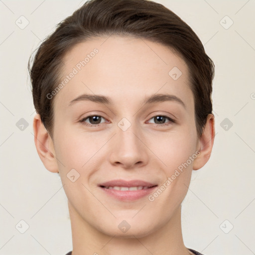 Joyful white young-adult female with short  brown hair and brown eyes