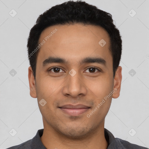 Joyful latino young-adult male with short  black hair and brown eyes